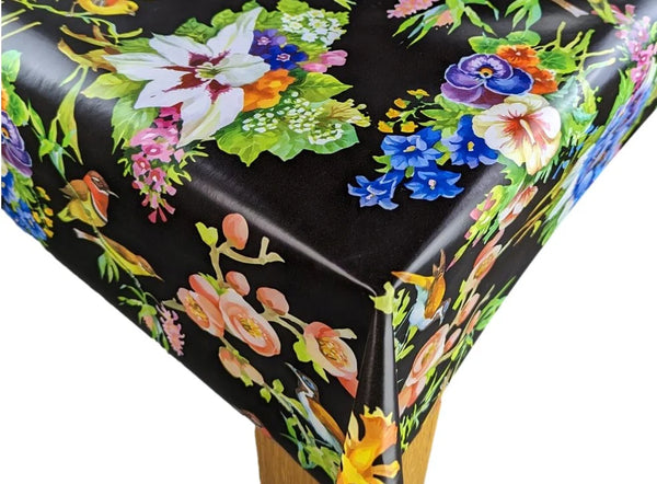 Bright Flowers on Black PVC Vinyl Wipe Clean Tablecloth  200cm x 140cm Warehouse Clearance